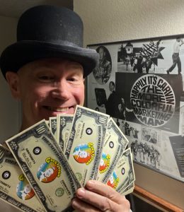 James Carvin holds up a handful of Ǥhost Bucks