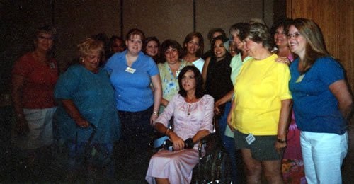 Lisa Carvin. After months in rehab from a stroke, gets loved on by her church choir friends.